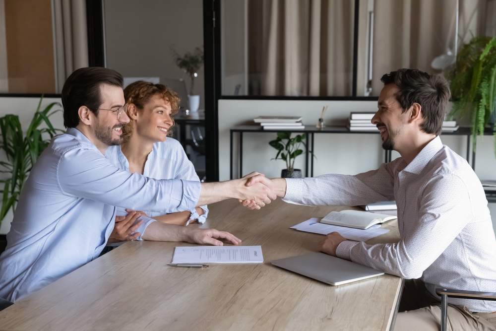 Solicitor shaking hands with a client