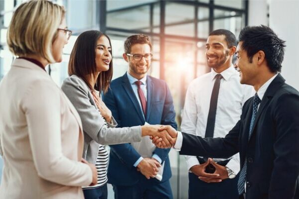 Our People A group of employees gather for a meeting