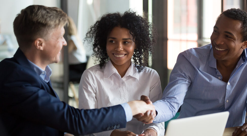 Transfer of Equity Client shaking hands with solicitor.